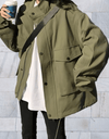 Annie -Lang en oversized jasje met knoopsluiting en diepe zijzakken