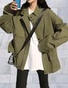 Annie -Lang en oversized jasje met knoopsluiting en diepe zijzakken