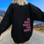Sweatshirts - Candelle | Comfortabele oversized hoodie met inspirerende tekst in pastelroze, inclusief capuchon en relaxte pasvorm - Zwart - S - Zarandi Amsterdam