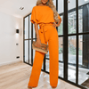 Women Trendy Outfit - Minerva | Zwarte feestelijke damesjumpsuit met gespdetail, vloeiende stof en mouwloos design voor een flatterend silhouet - Oranje - S - Zarandi Amsterdam