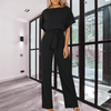 Women Trendy Outfit - Minerva | Zwarte feestelijke damesjumpsuit met gespdetail, vloeiende stof en mouwloos design voor een flatterend silhouet - Zwart - S - Zarandi Amsterdam