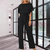 Women Trendy Outfit - Minerva | Zwarte feestelijke damesjumpsuit met gespdetail, vloeiende stof en mouwloos design voor een flatterend silhouet - Zwart - S - Zarandi Amsterdam